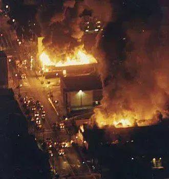Helicopter-View: Big Buildings burning in the night.